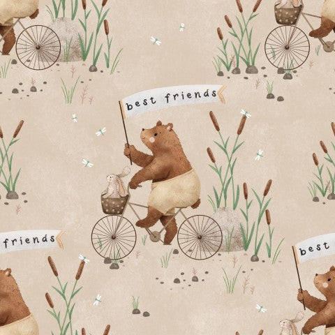 Muslin with a bear on a bicycle and a sign saying “Best Friends”