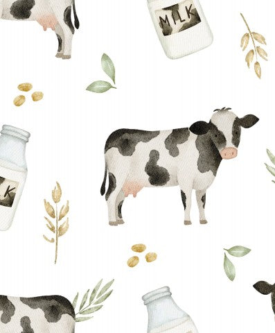 Vaches en mousseline et bouteilles de lait