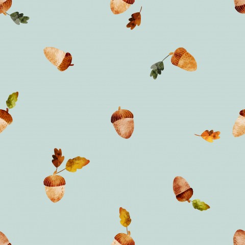 Muslin acorns and leaves on a blue background