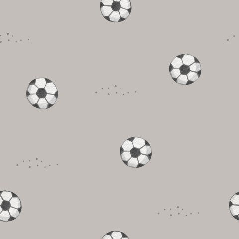 French Terry, un motivo di palloni da calcio su uno sfondo grigio