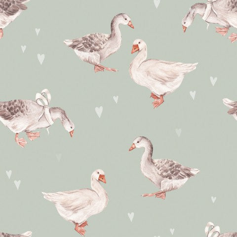 Satin cotton a pattern of ducks and hearts on a green background