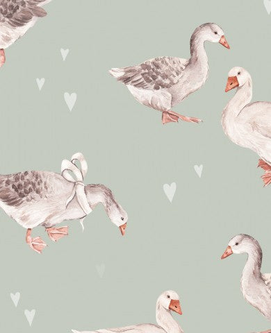 Muslin a pattern of ducks and hearts on a green background