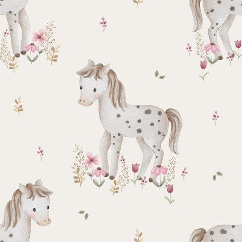 Muslin et mønster af heste og blomster på en hvid baggrund