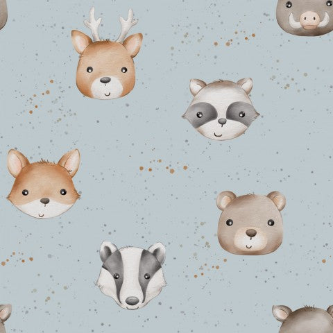 French Terry pattern of forest animals on a blue background
