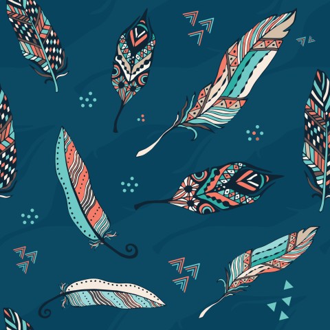 Muslin colorful feathers on blue background