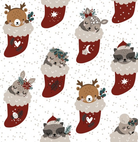 Animaux mignons en toile de coton dans des bas de Noël